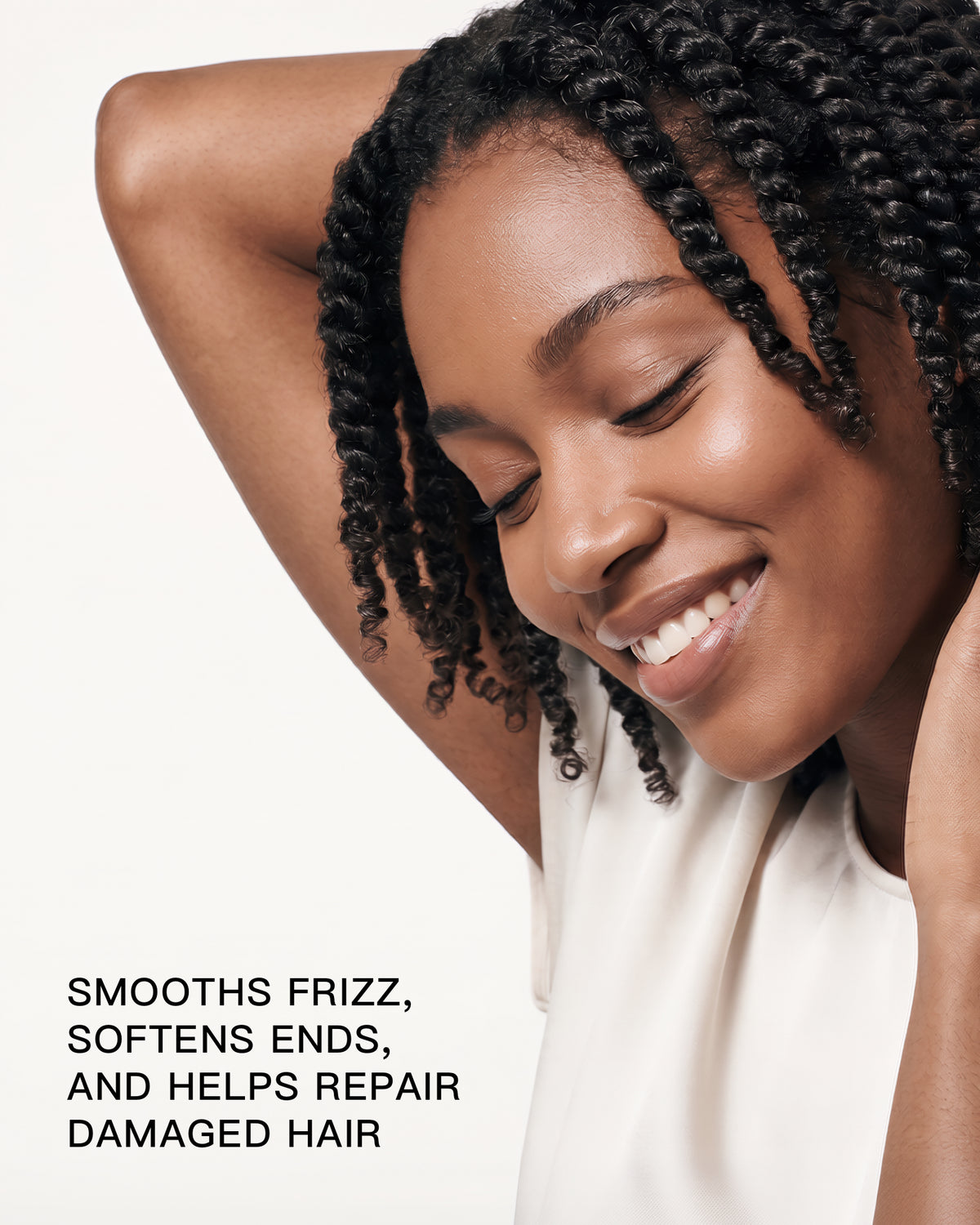 Woman with textured hair highlighting GRANTED T.01 leave-in treatment for frizz and damaged hair