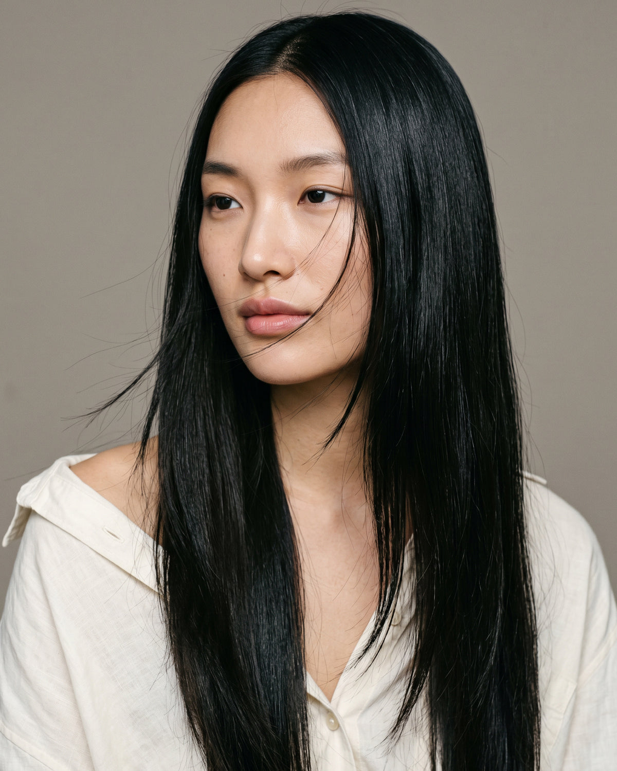 Woman with long smooth straight black hair