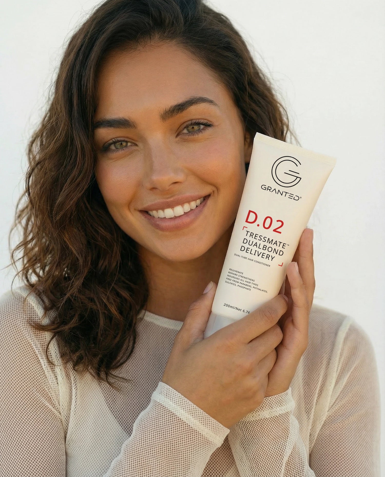 Packshot of Granted D.02 Tressmate DualBond Conditioner, front label, bond repair formula.