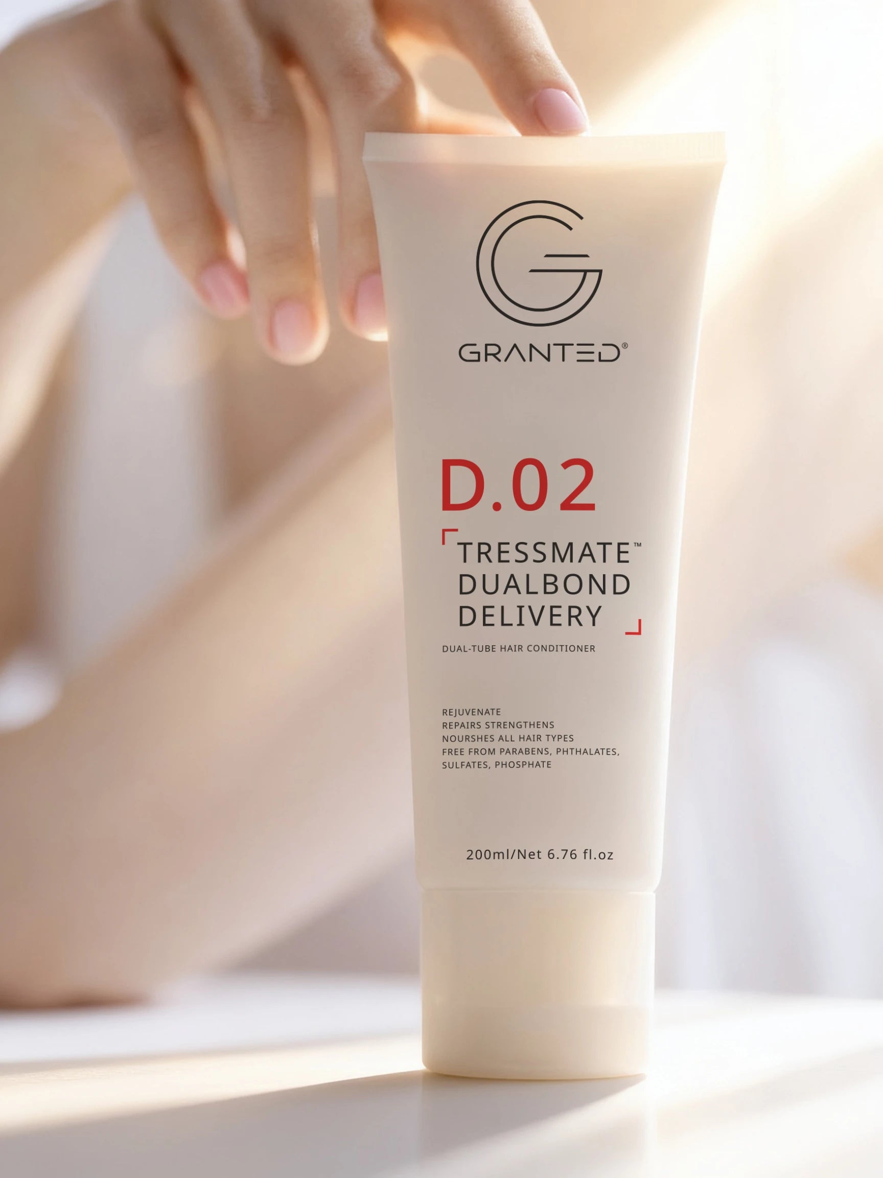 Packshot of Granted D.02 Tressmate DualBond Conditioner, front label, bond repair formula.