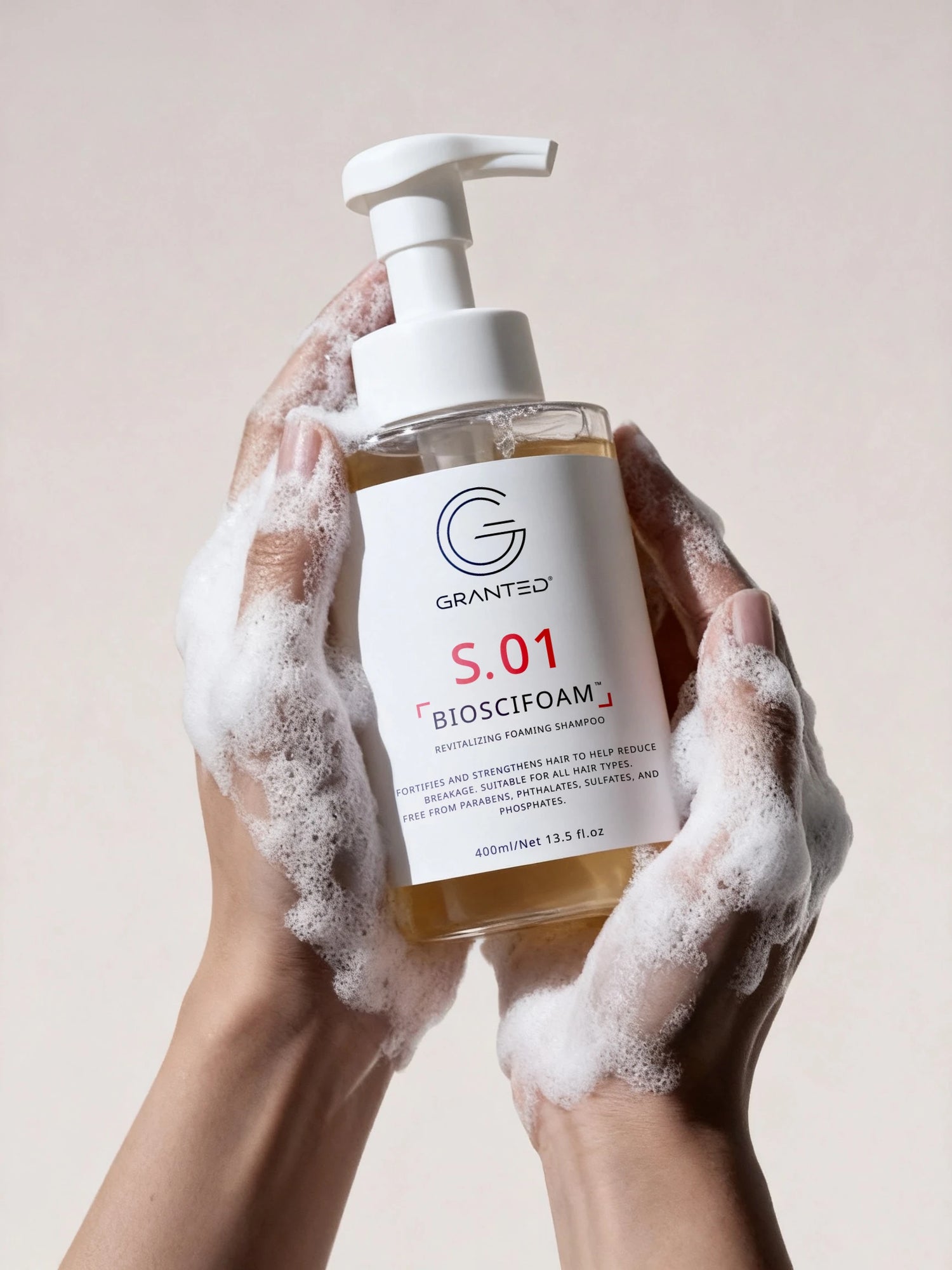 Single Granted S.02 BIOSCIFOAM bottle product shot; repair shampoo for damaged hair.