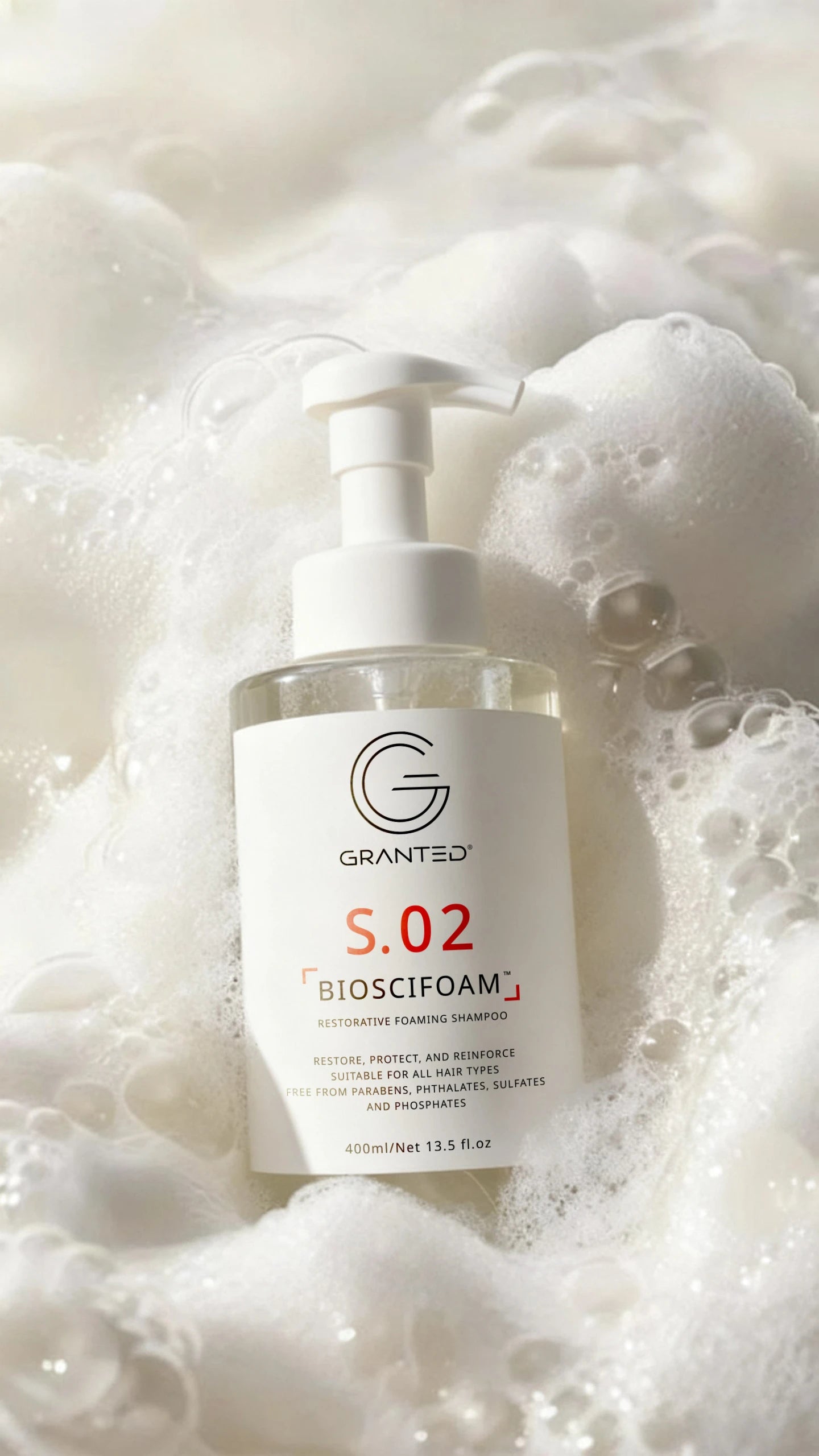 Single Granted S.02 BIOSCIFOAM bottle product shot; repair shampoo for damaged hair.