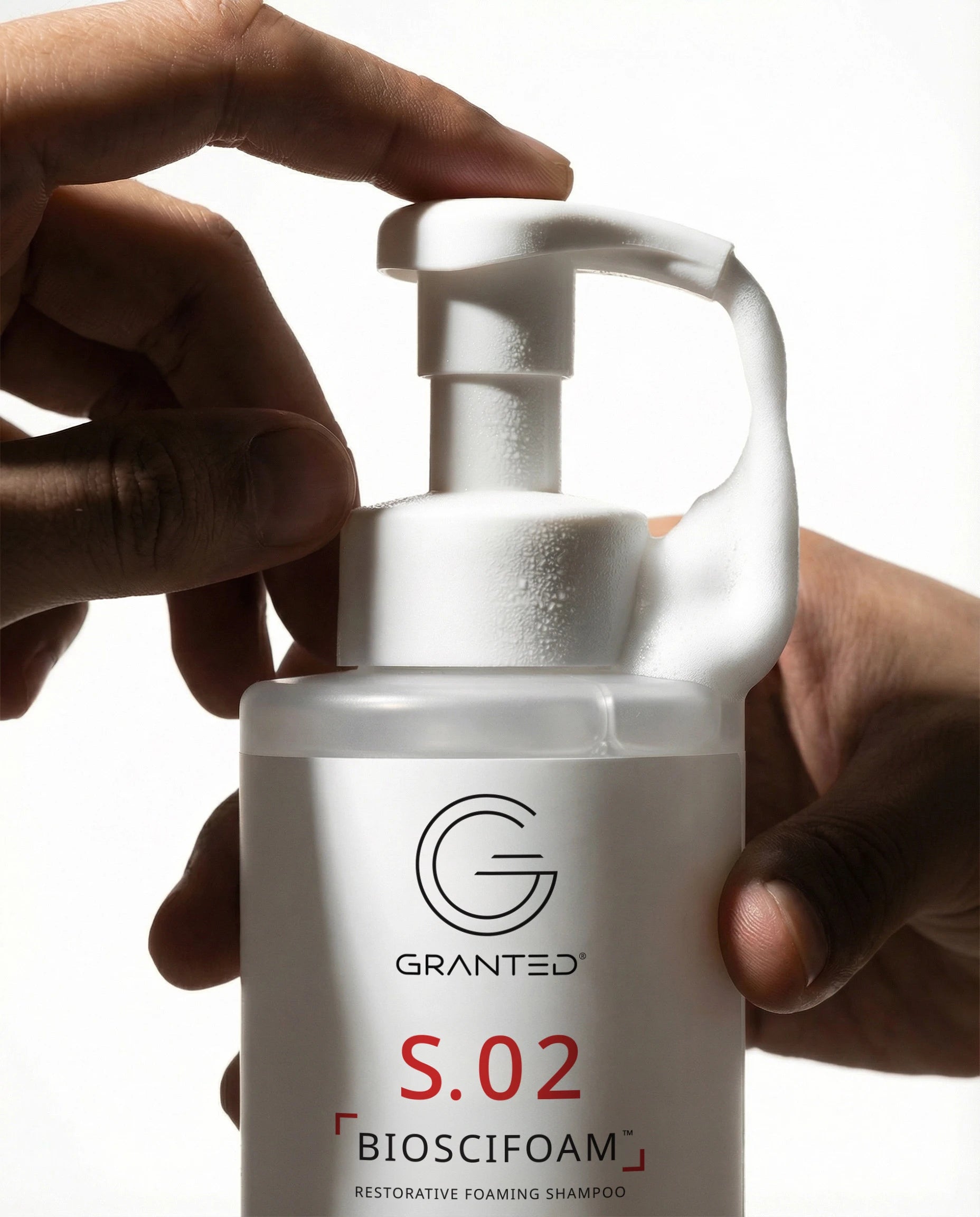 Single Granted S.02 BIOSCIFOAM bottle product shot; repair shampoo for damaged hair.